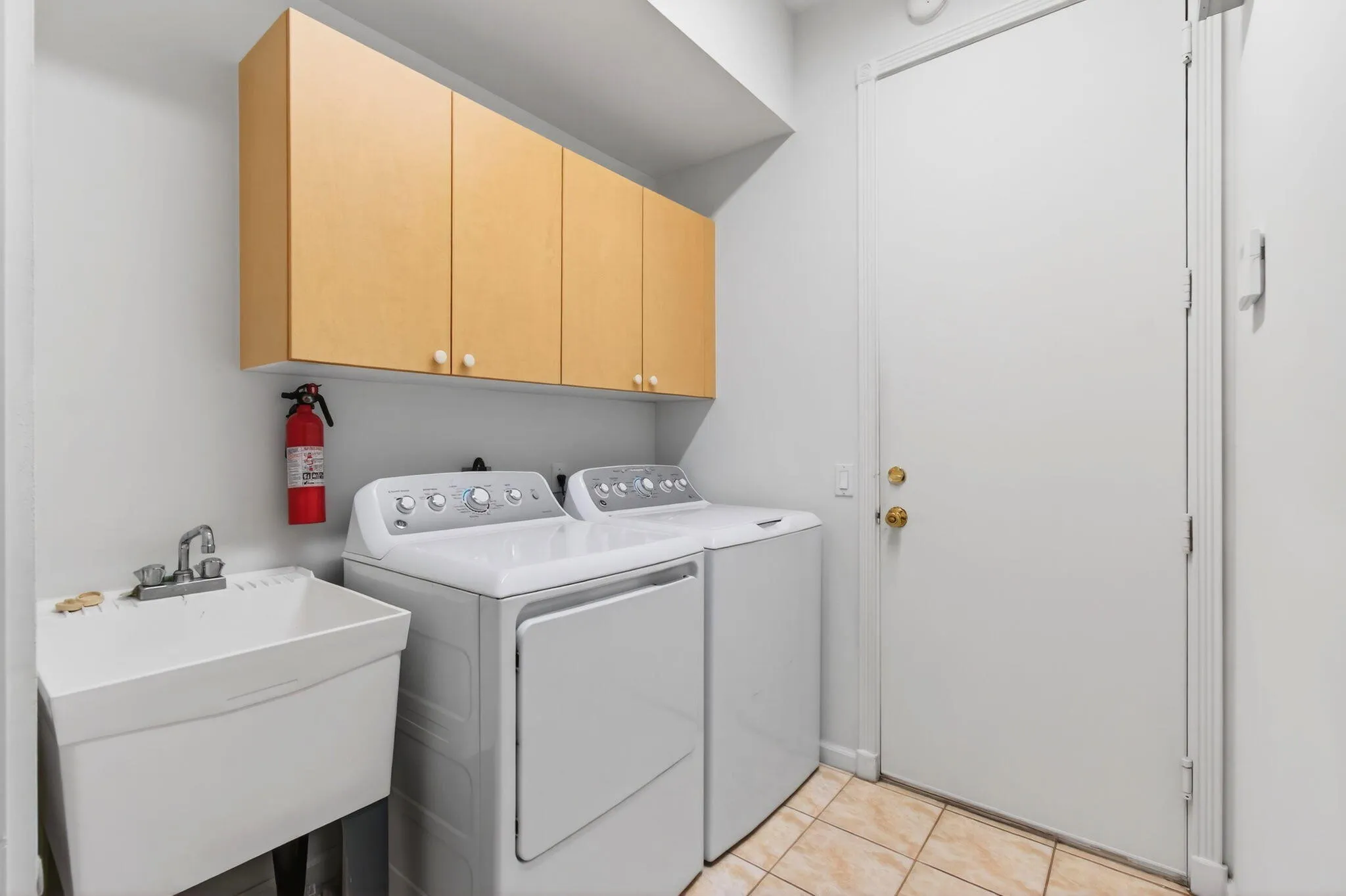 Interior Laundry Room leads to garage and has a slop sink