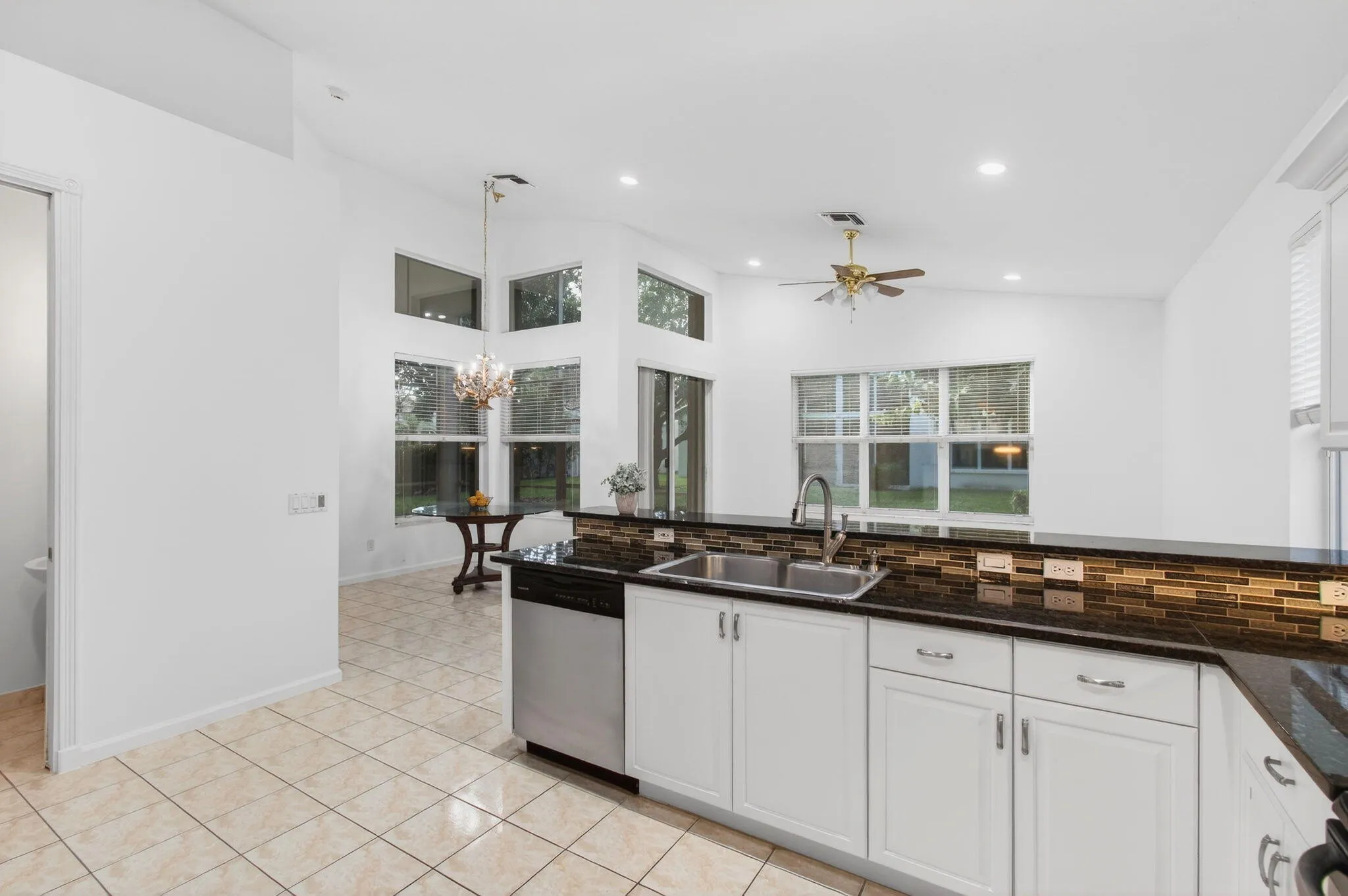 Kitchen overlooks Breakfast Nook and Family Room