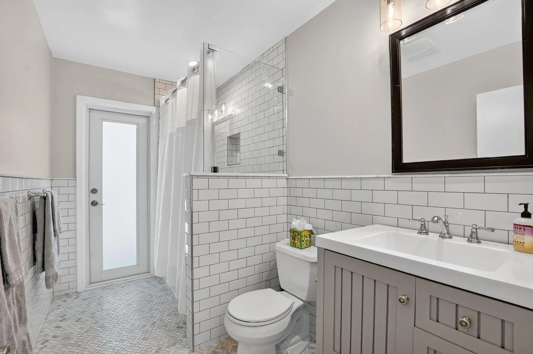 The lovely guest bath doubles as a cabana bath
