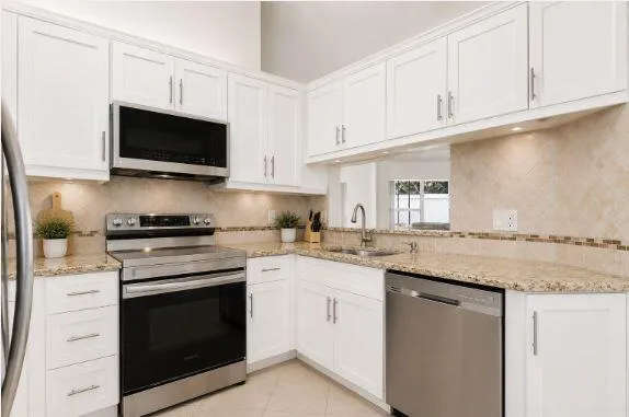 Kitchen - with cabinets virtually painted white and new hardware