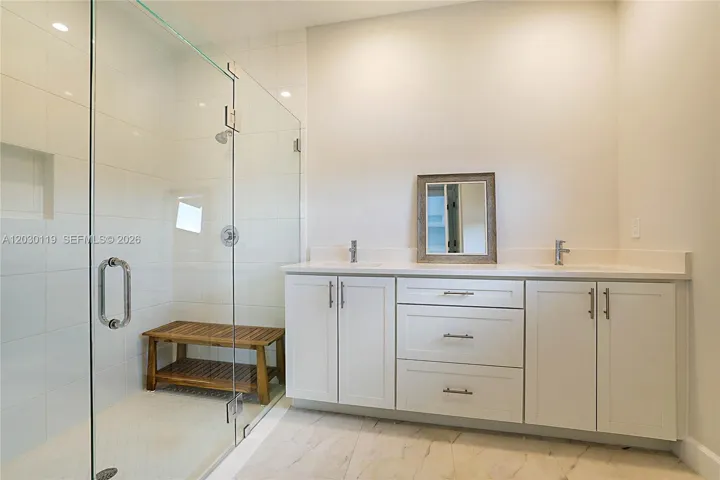 Primary Bathroom with Dual Sinks and Shower