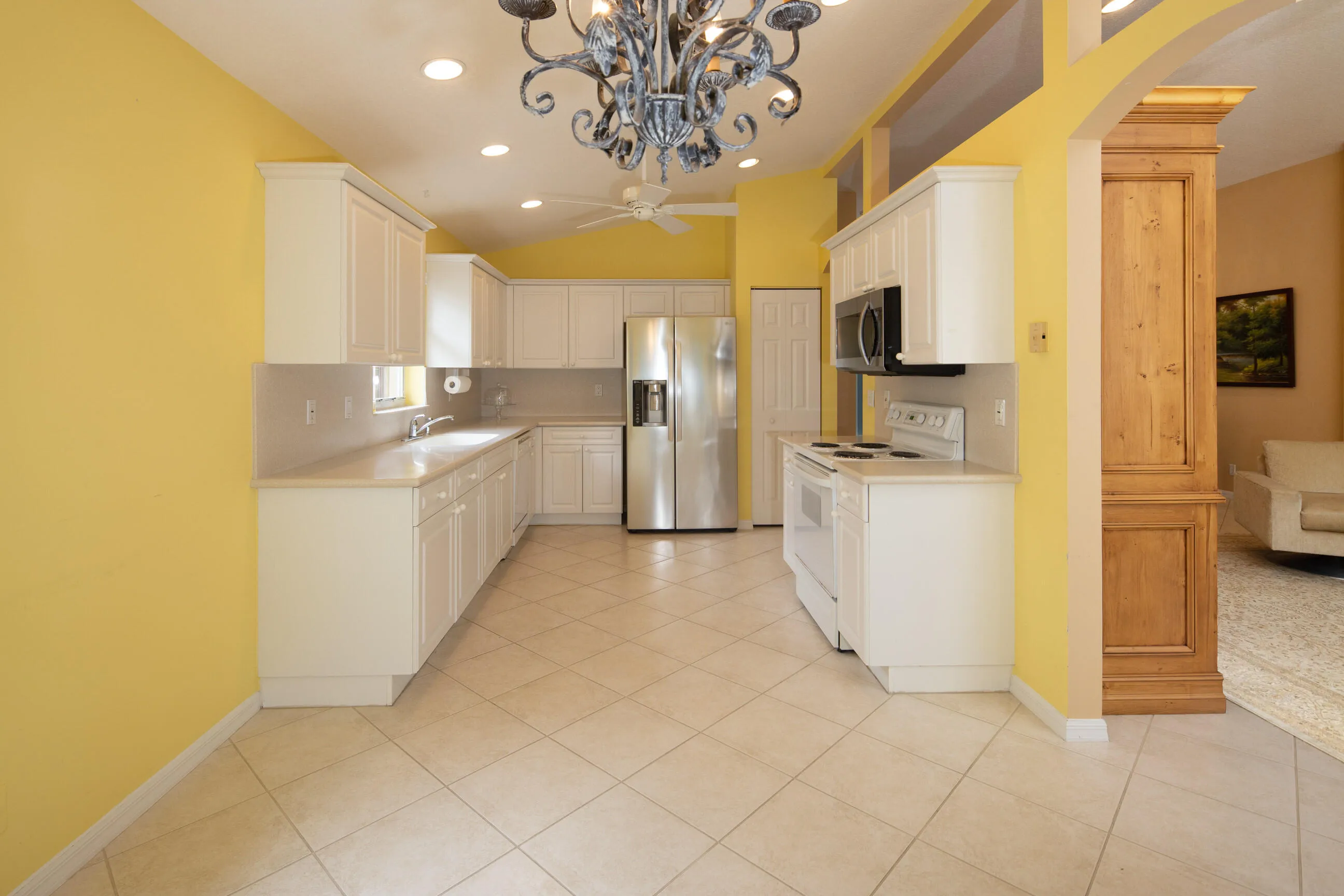 Move in ready home in Bellaggio featuring 2 bedrooms plus den, screened lanai, lake park views and pet friendly living.
