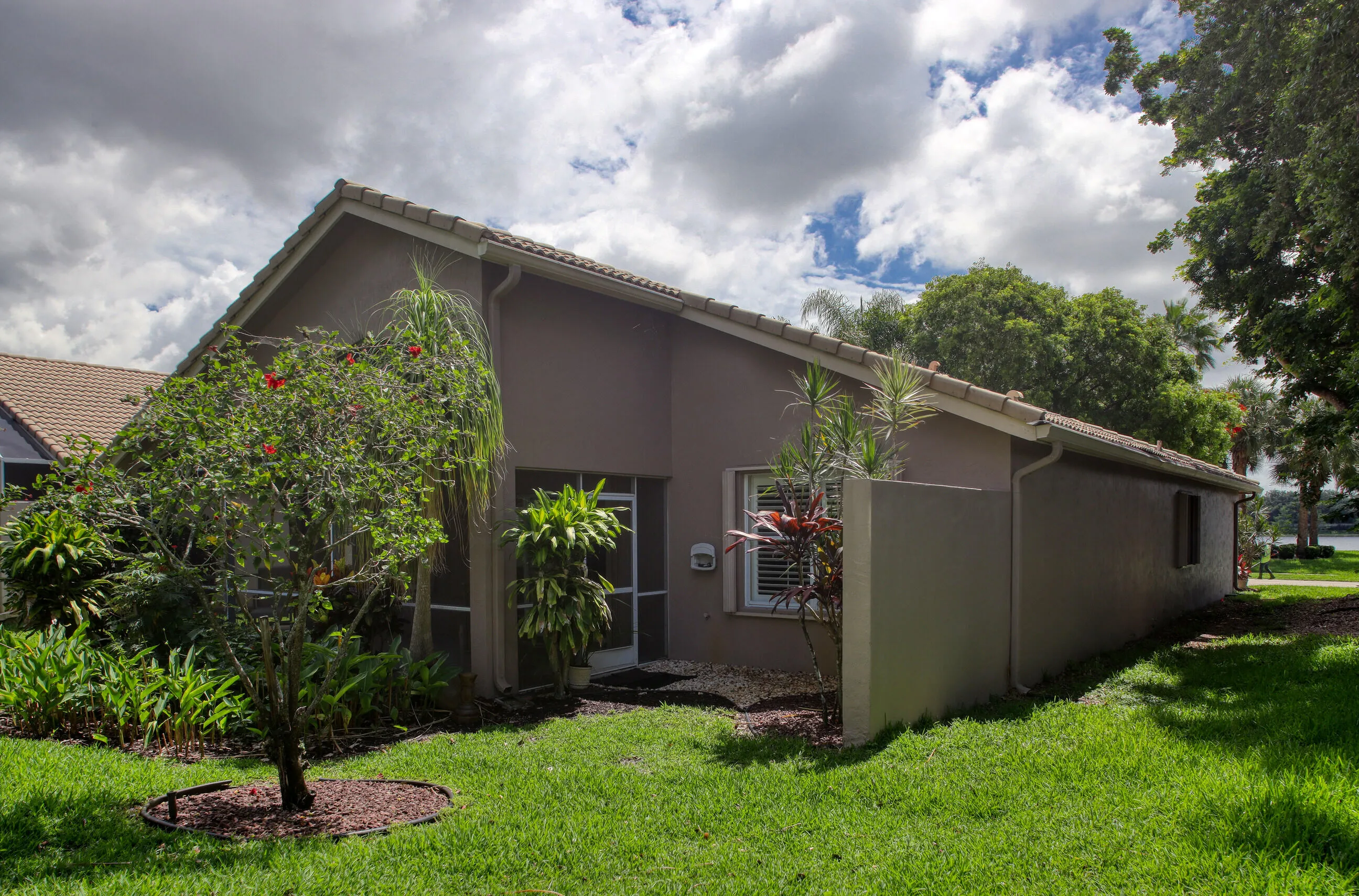 Move in ready home in Bellaggio featuring 2 bedrooms plus den, screened lanai, lake park views and pet friendly living.
