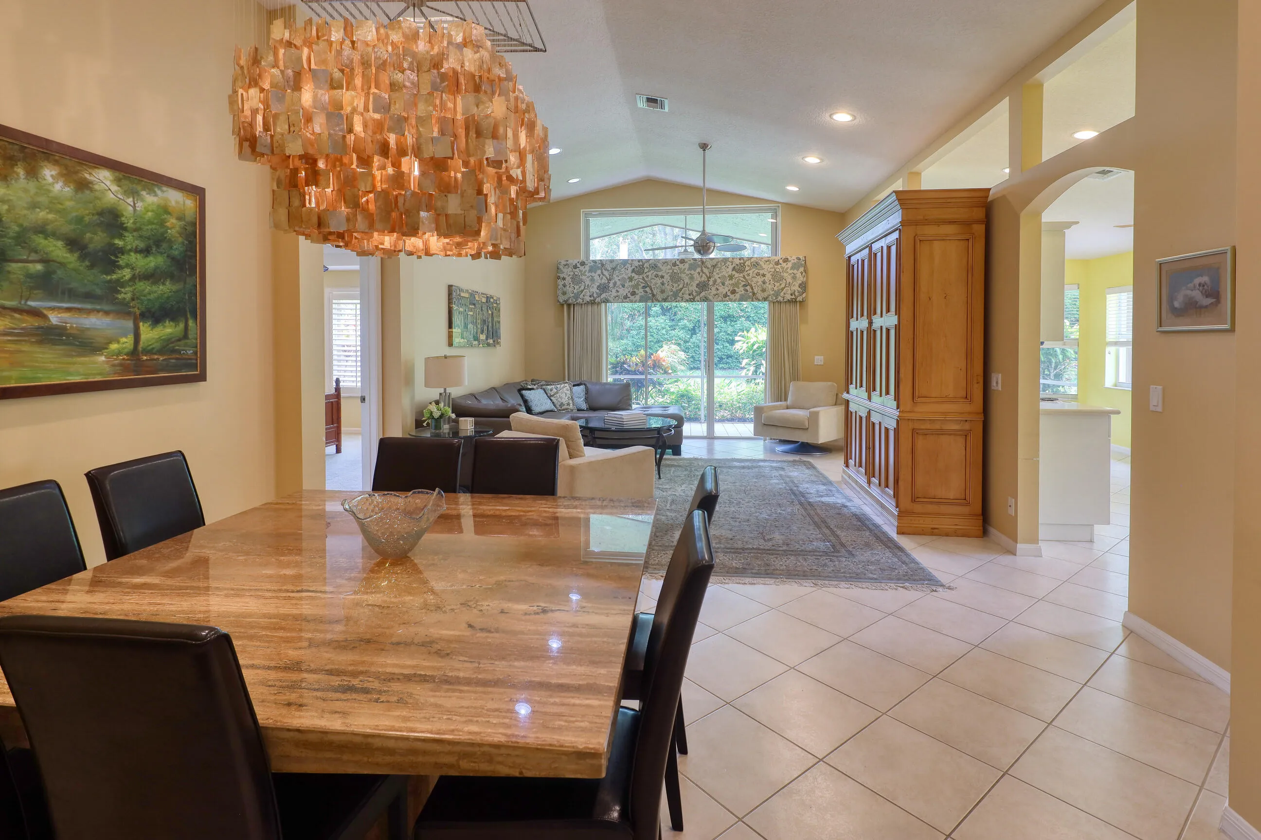 Move in ready home in Bellaggio featuring 2 bedrooms plus den, screened lanai, lake park views and pet friendly living.