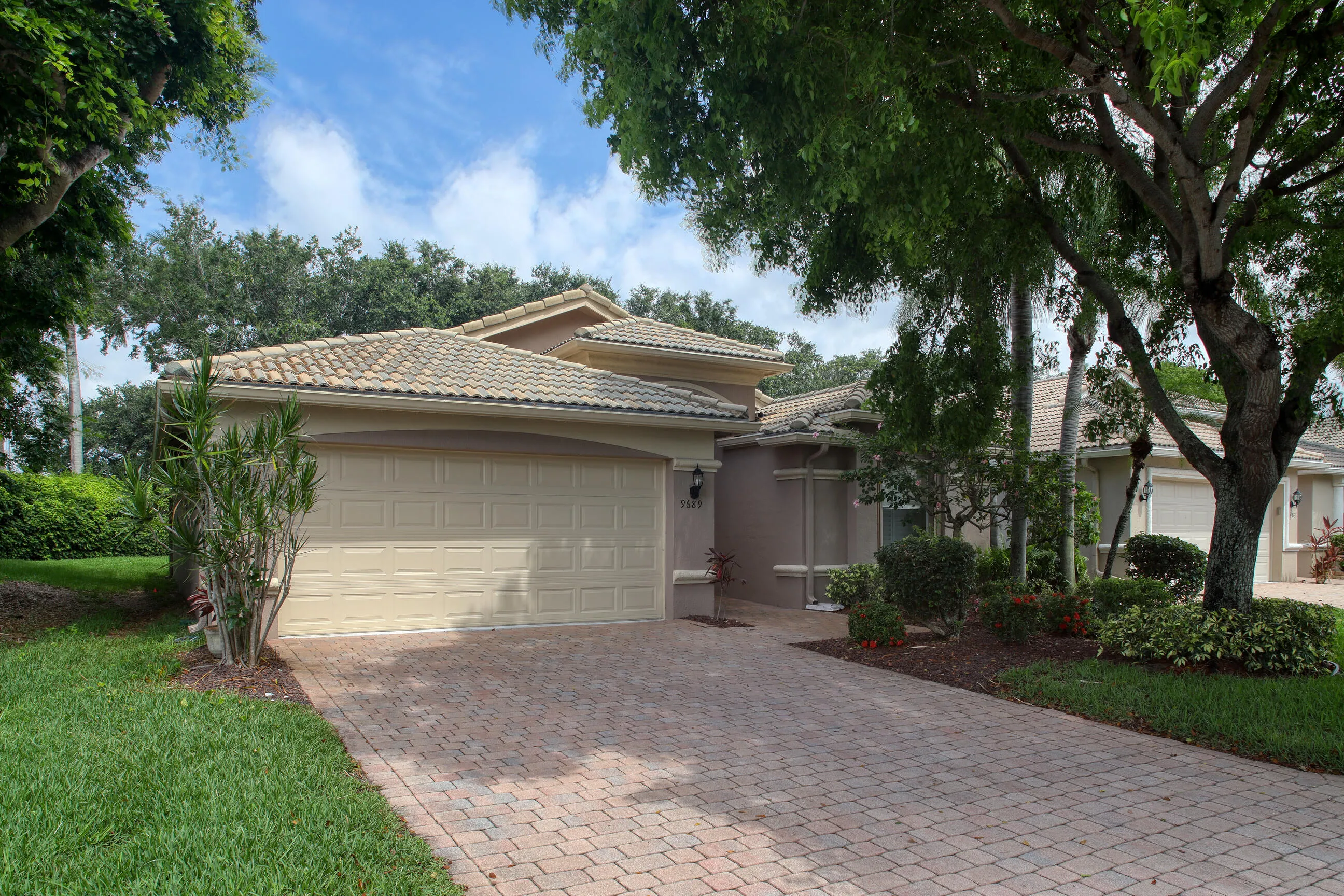 Move in ready home in Bellaggio featuring 2 bedrooms plus den, screened lanai, lake park views and pet friendly living.