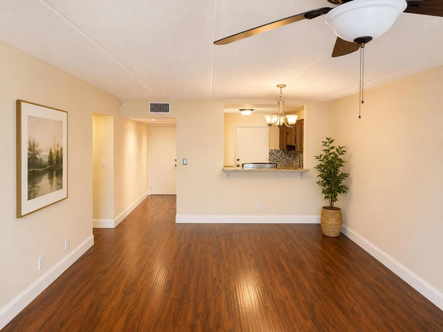 Living room w/ laminate floors.