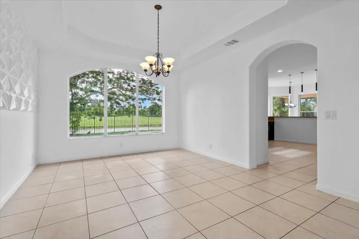 FORMAL DINING ROOM WITH A LAKE VIEW
