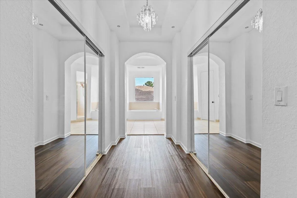 EN-SUITE WALK-IN CLOSET HALLWAY IN MAIN MASTER SUITE ON SECOND FLOOR