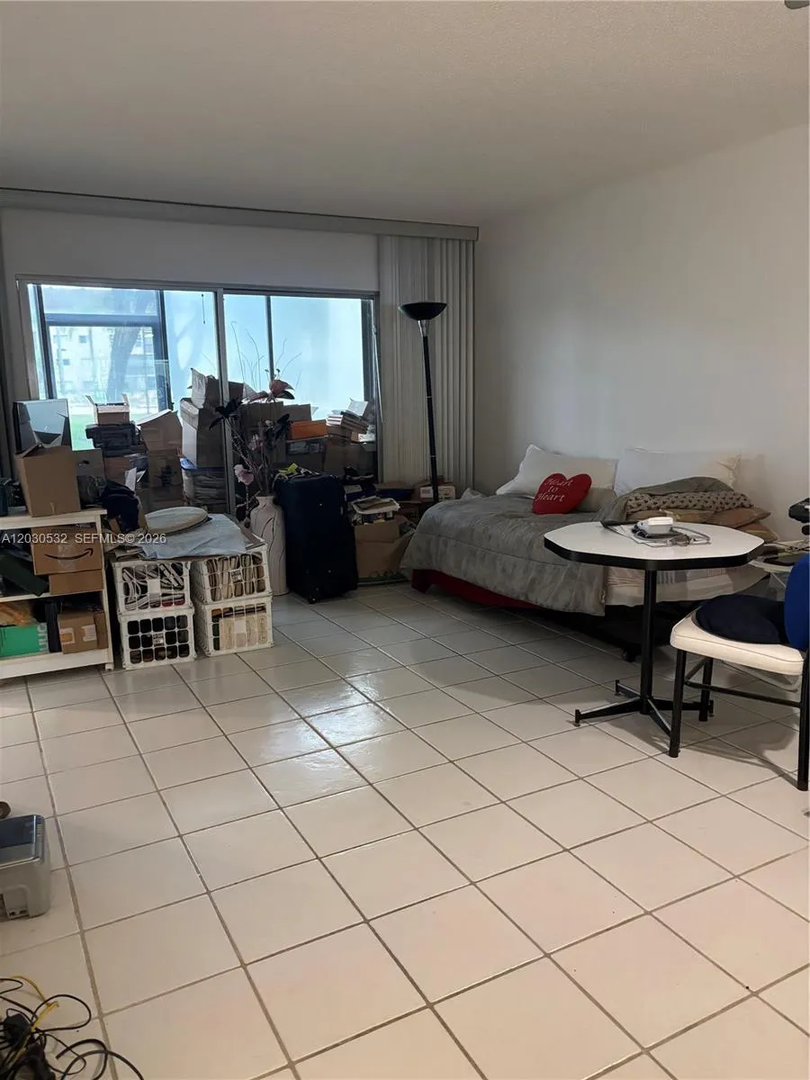 THE LIVING ROOM/DINING ROOM AREA