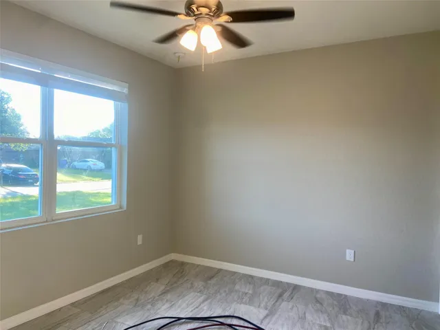 hall bath with tub/shower combo, granite counter tops