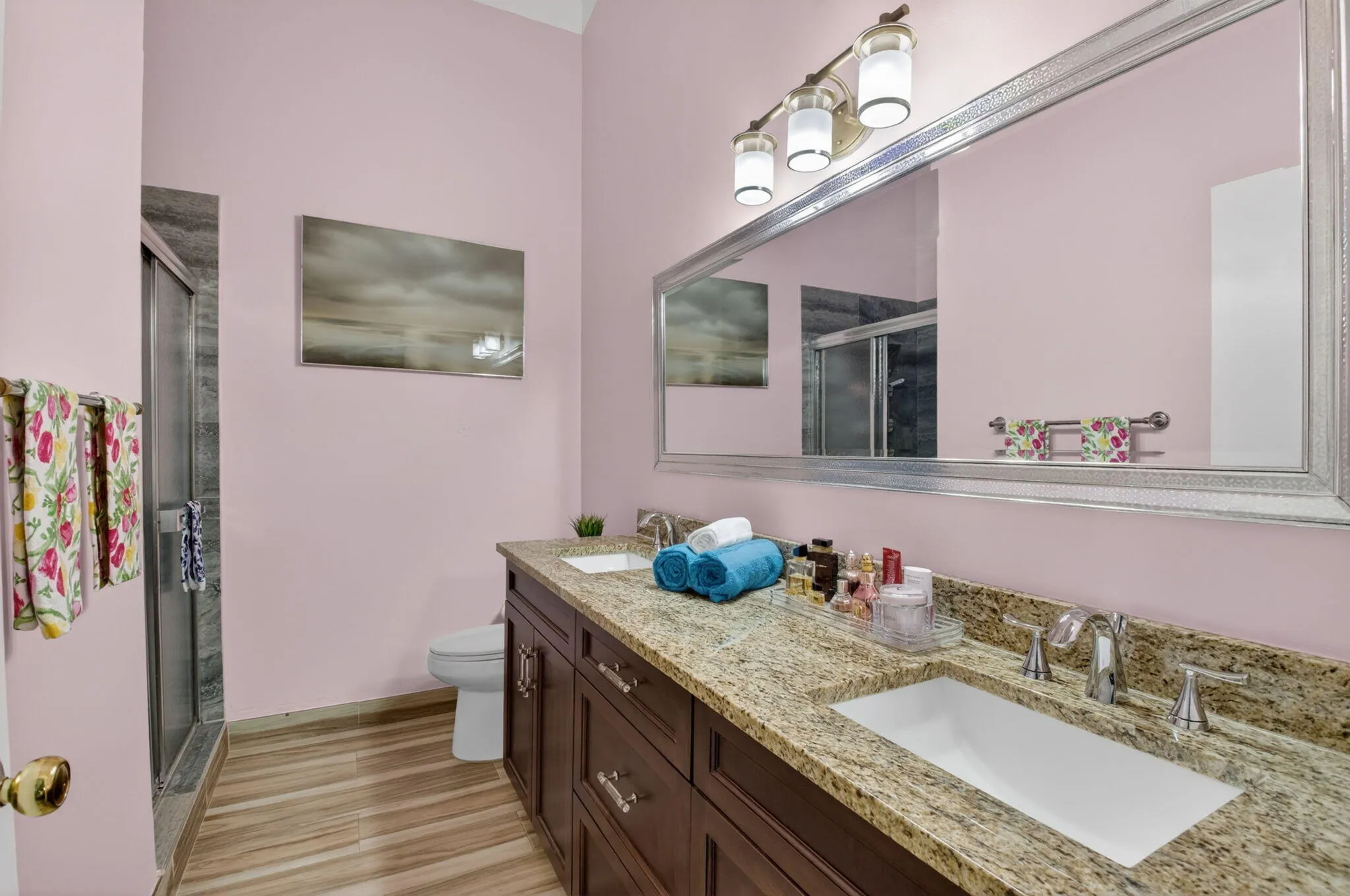 Beautiful primary bath has a counter height vanity with double undermount sinks.