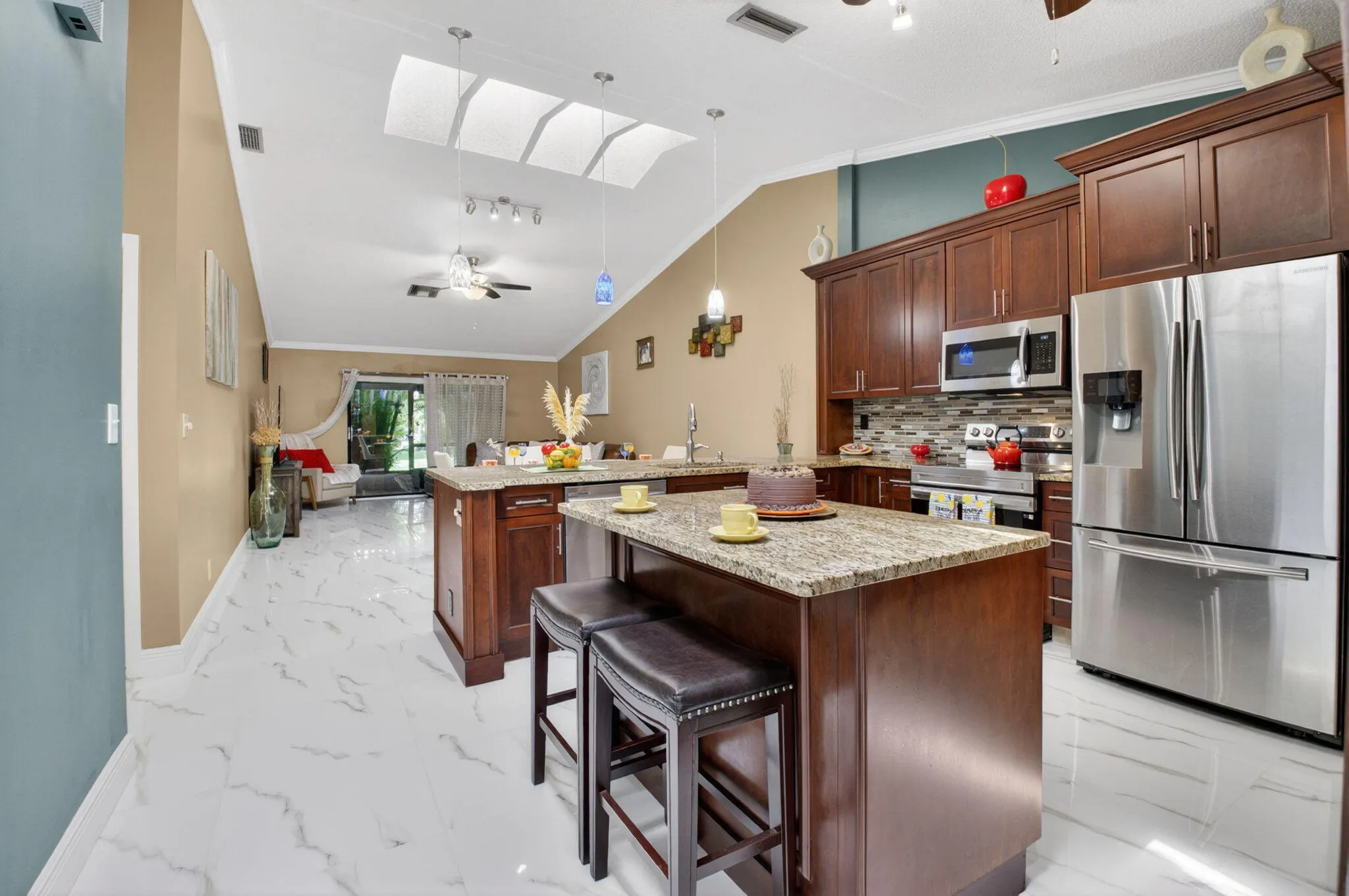 Entertaining is a breeze in your UPDATED kitchen featuring Samsung S/S appiances and granite counters.