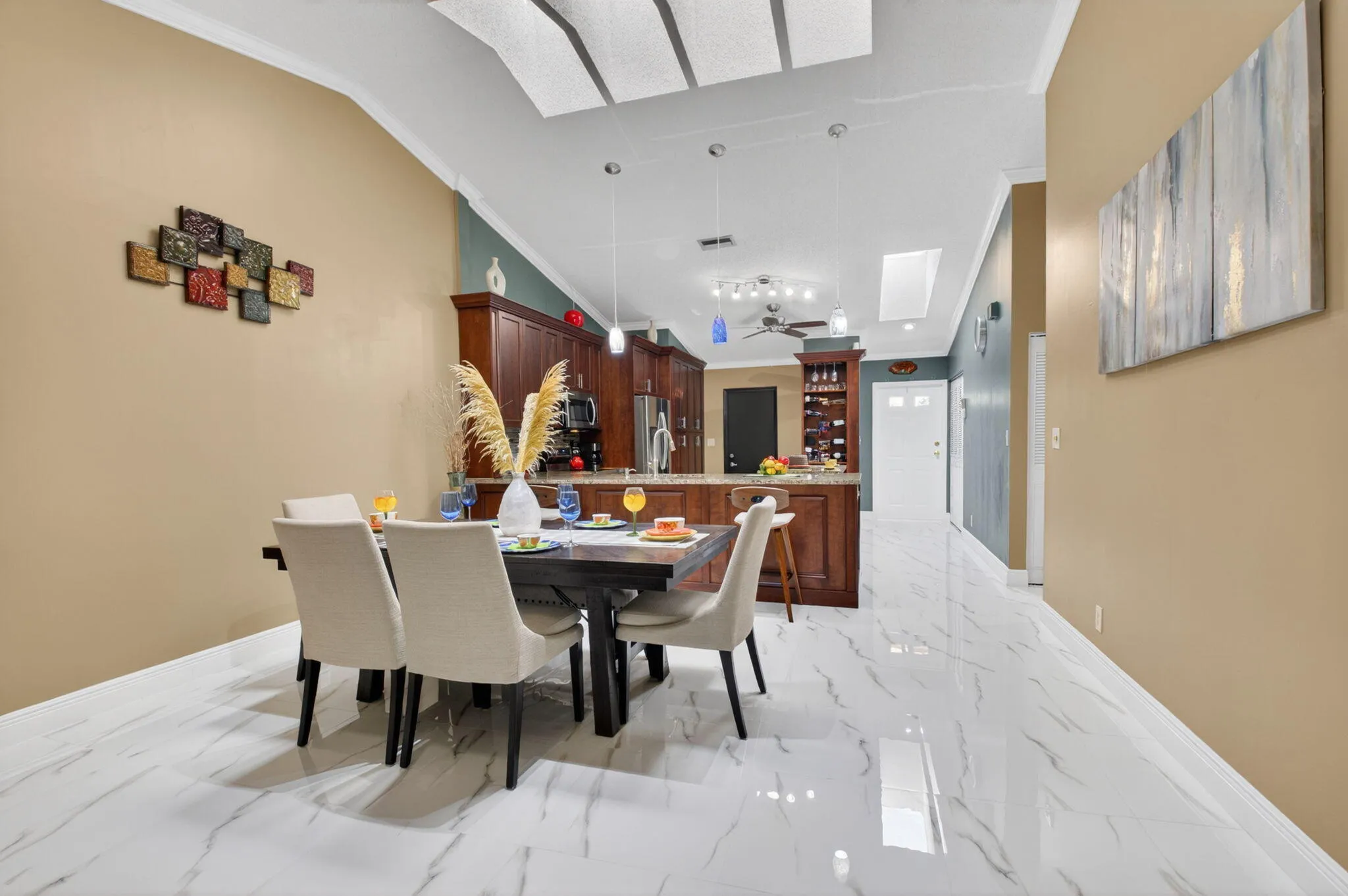 12' Soaring ceilings adorned with knockdown finish along with 5 skylights provide tons of natural light.