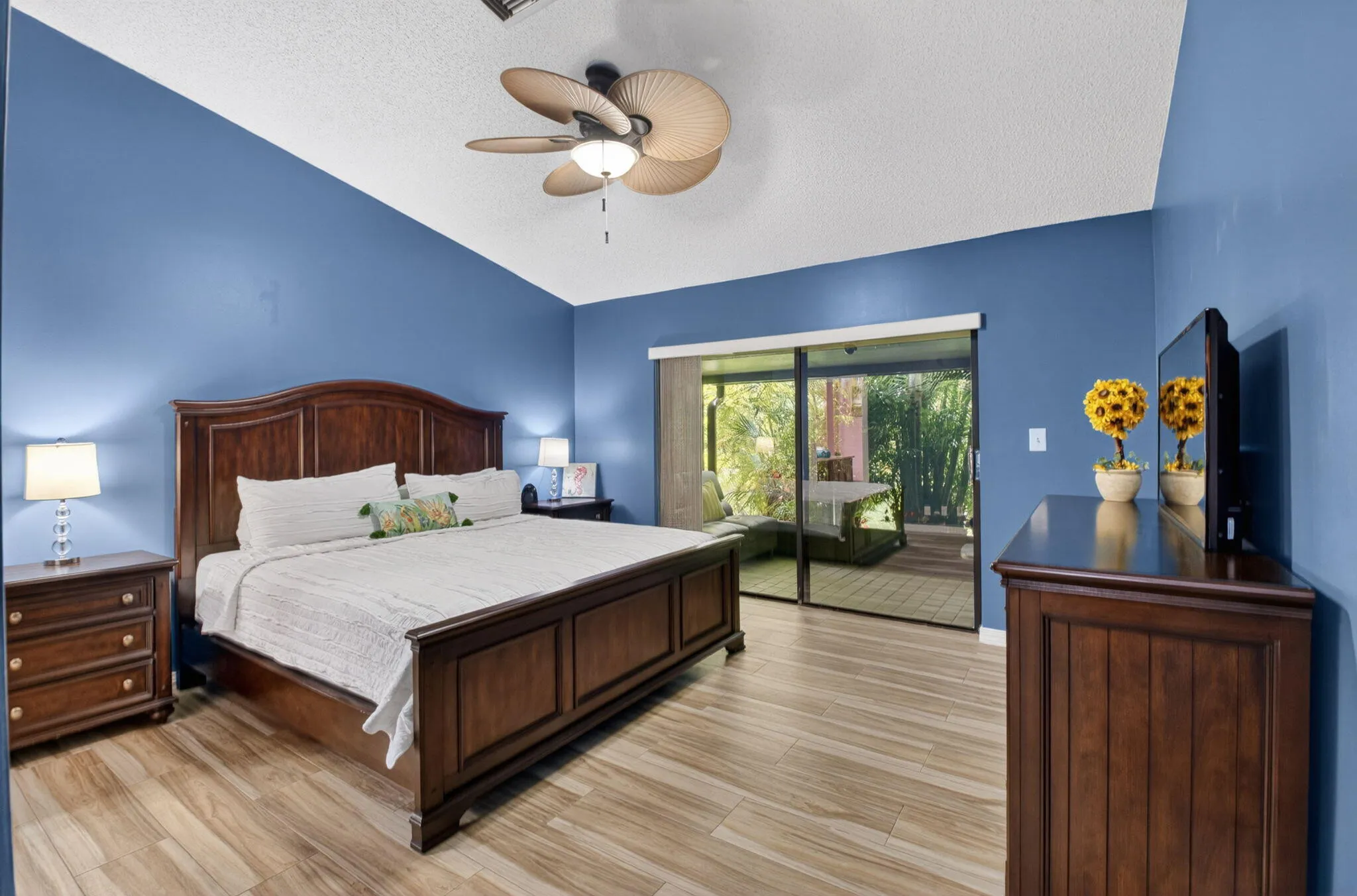 Fall in love in your oversized primary suite with vaulted ceiling, and new wood look ceramic tile flooring.