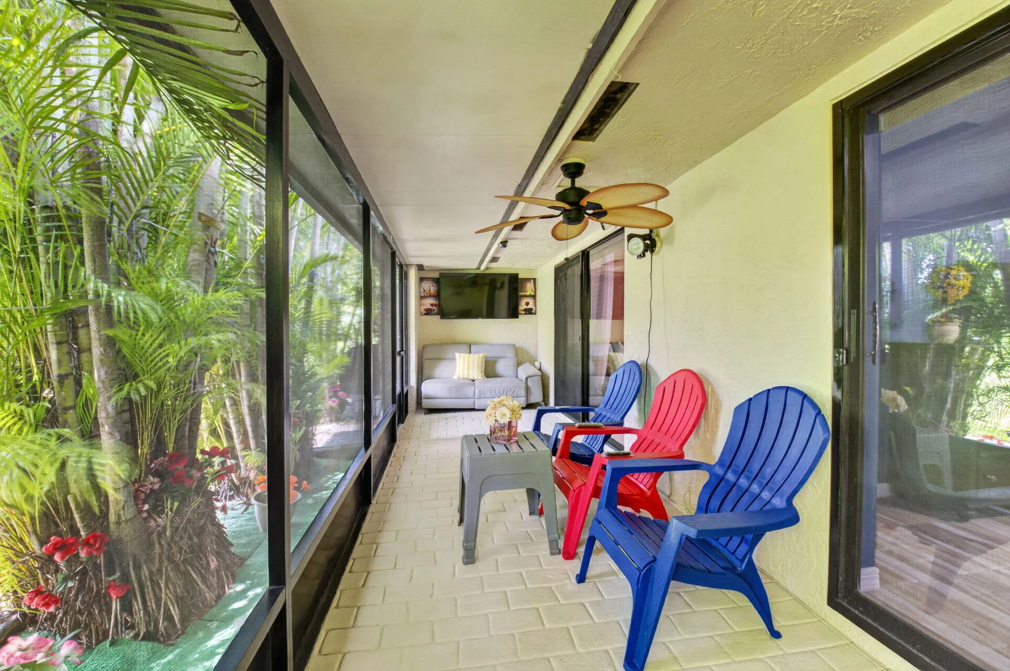 Relax on the 30' long screened and covered patio overlooking the lush gardens.