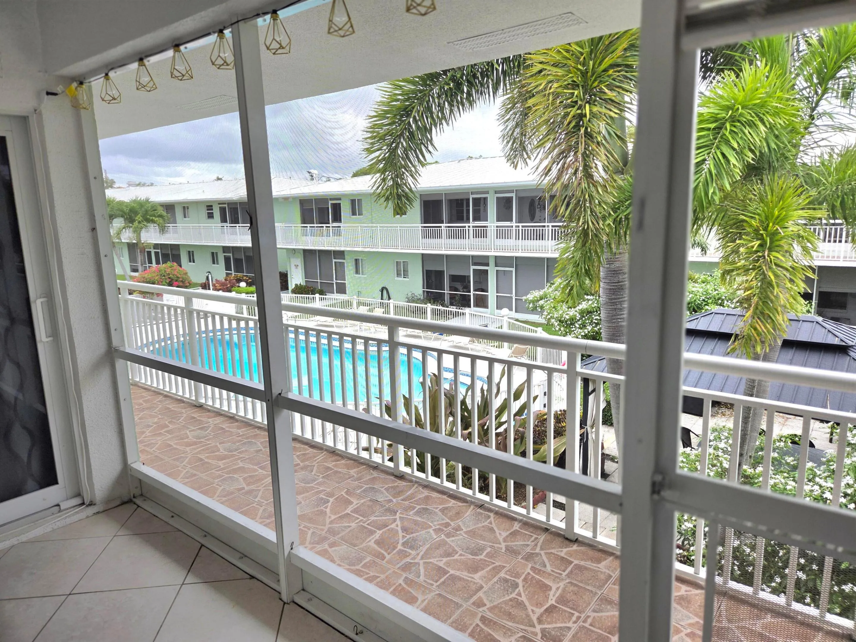 View of the pool from the​​‌​​​​‌​​‌‌​‌‌​​​‌‌​‌​‌​‌​​​‌​​ lanai