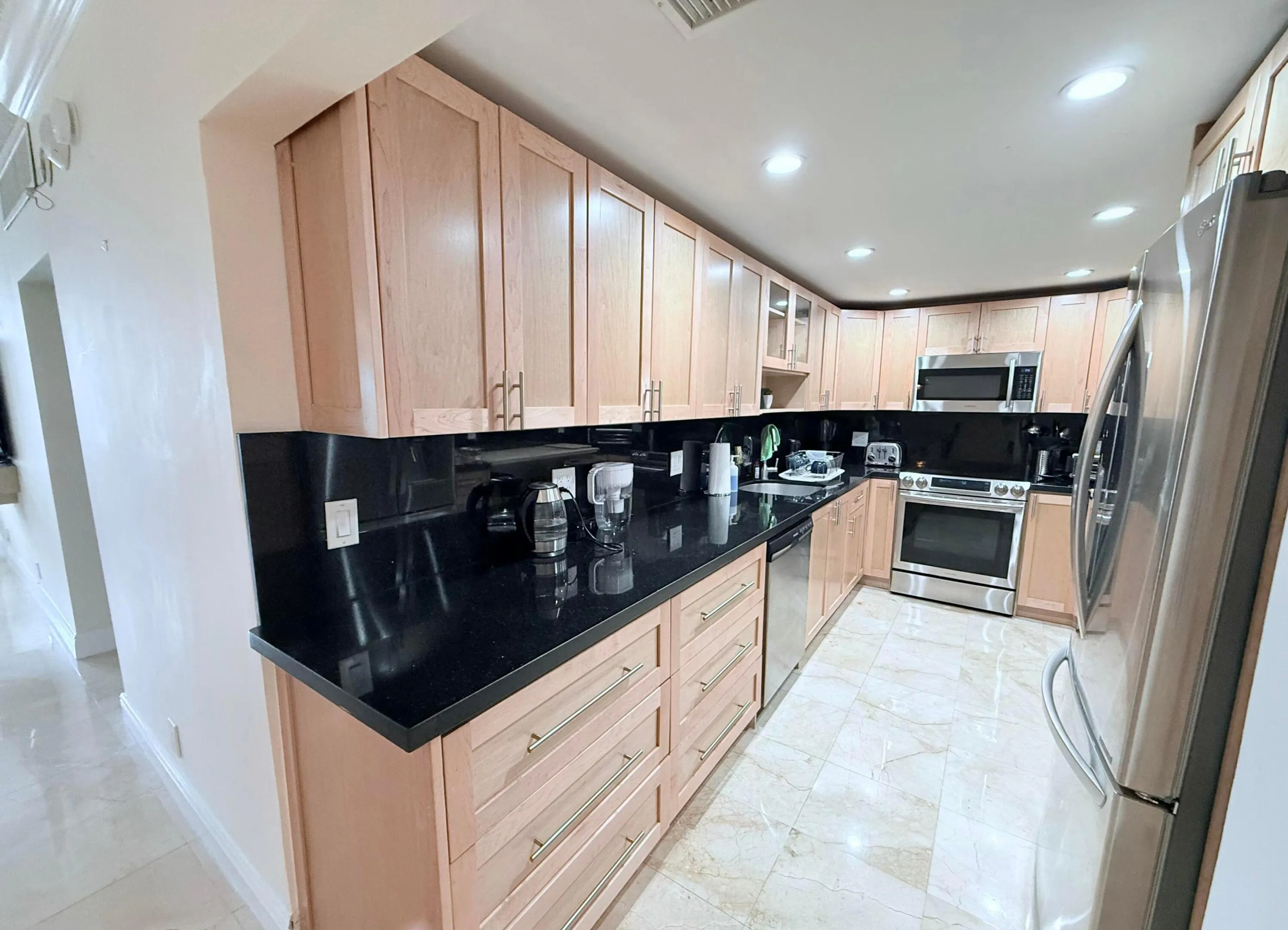 Granite counter tops, custom lighting and plenty of cabinets