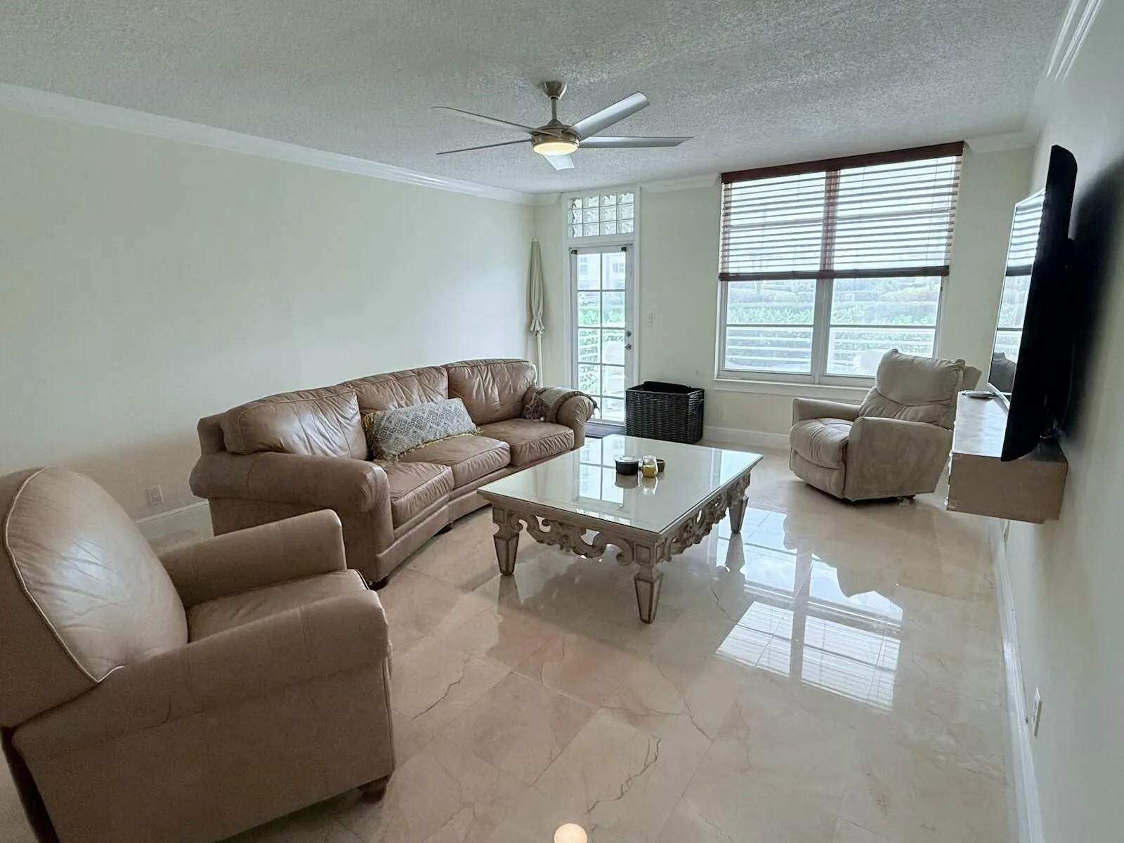 East exposure with French door to balcony--Hurricane proof windows and door throughout