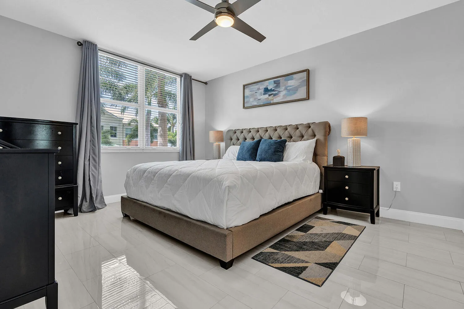 Primary Bedroom with King Size Bed, Large TV, and Walk-in Closet