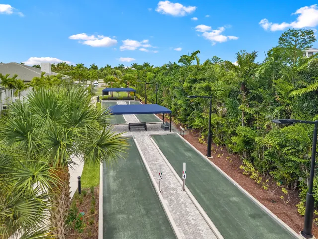 Bocce courts with shaded seating areas