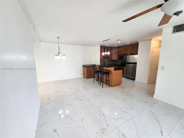 Modern Open-Concept Design Featuring Stunning Rectified Porcelain Tile Flooring Throughout!