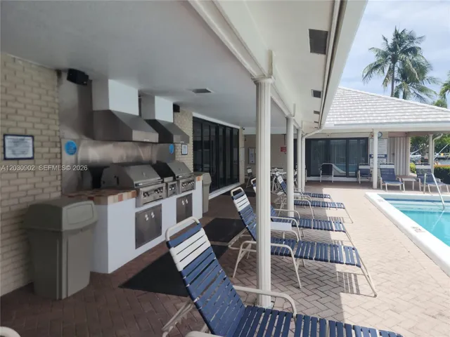 Poolside BBQ area, perfect for outdoor dining and entertaining.