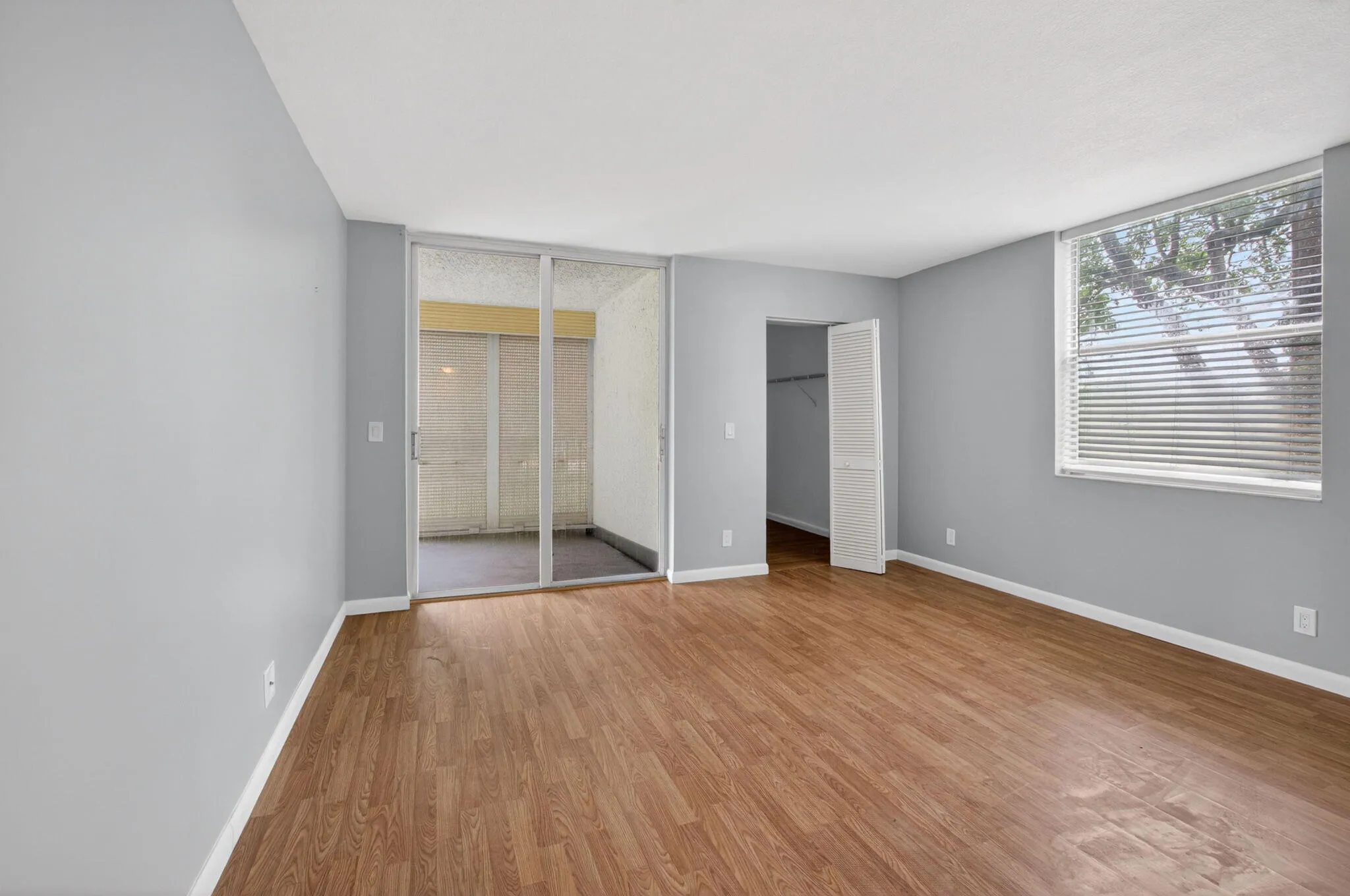 Primary bedroom with balcony access