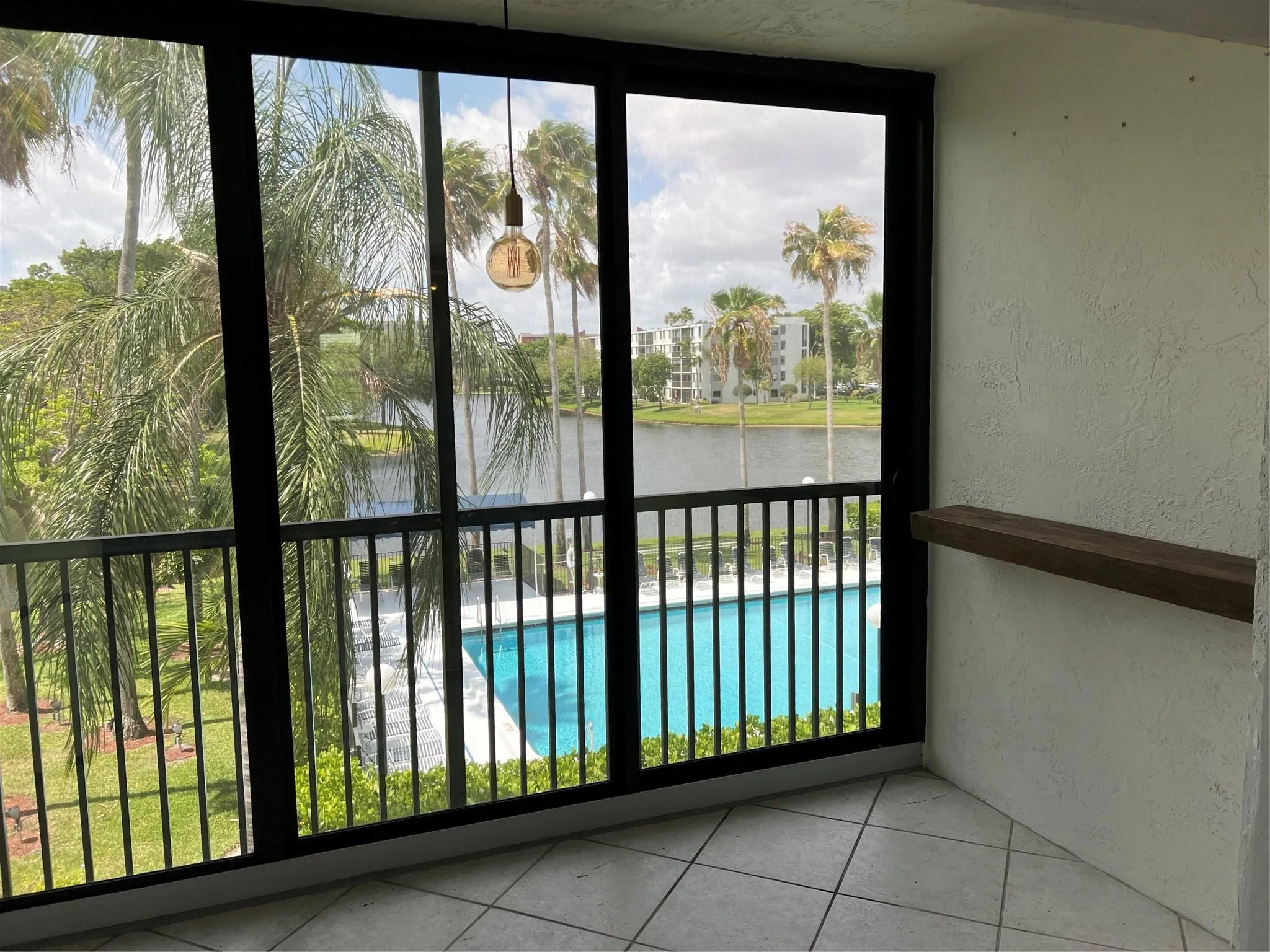 Enclosed balcony with nice pool views