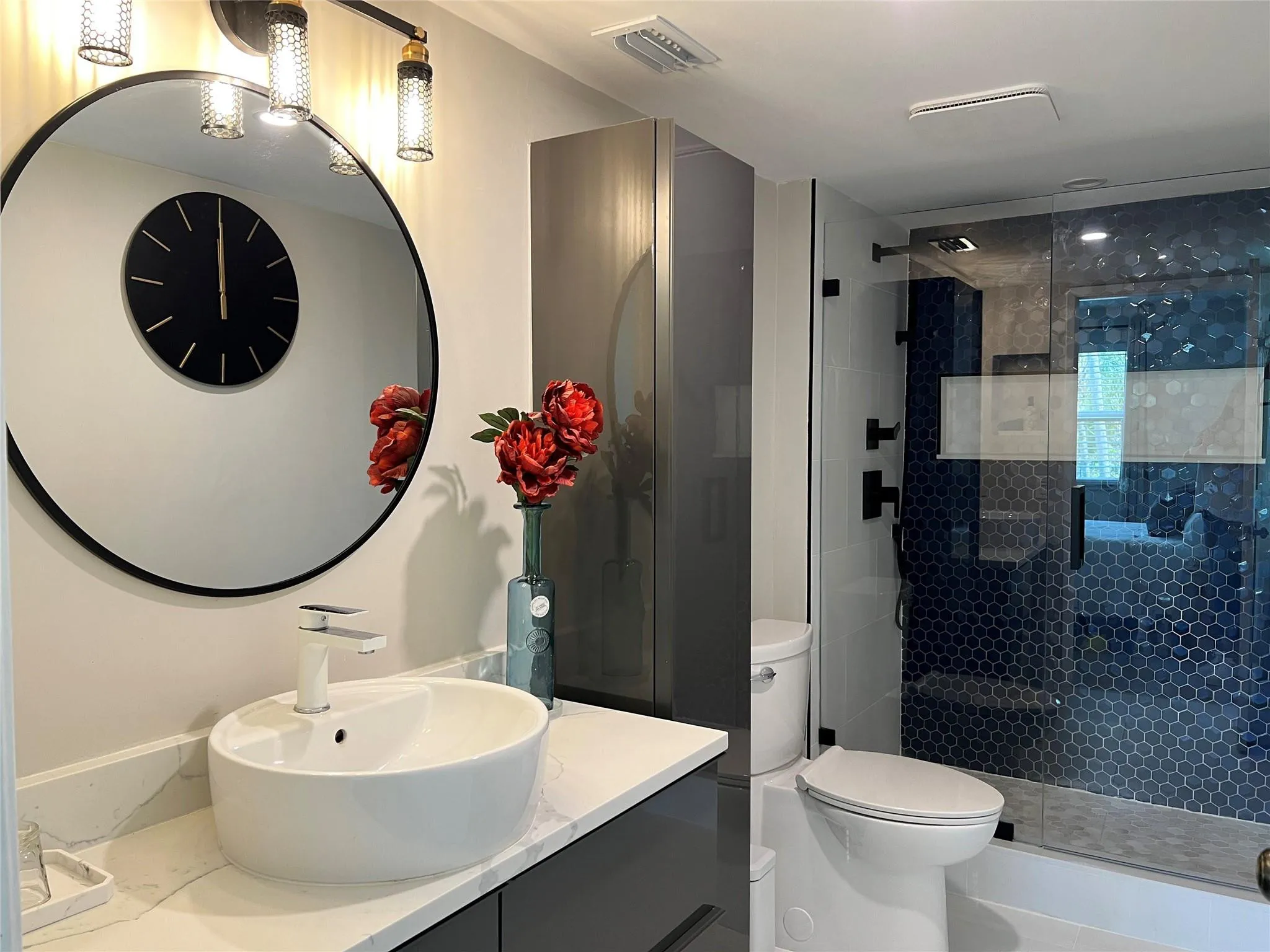 Primary bathroom with frameless shower enclosure