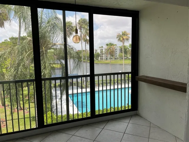 Enclosed balcony with nice pool views