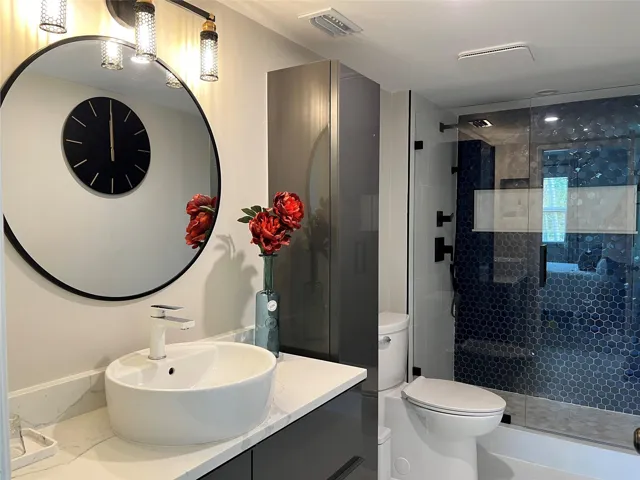 Primary bathroom with frameless shower enclosure