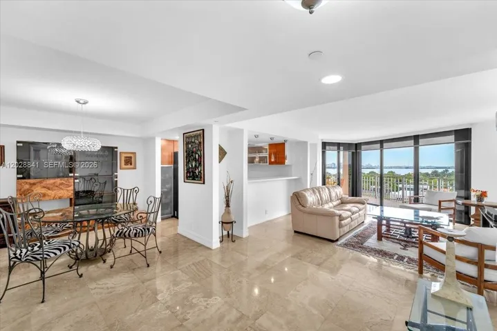 The living and dining area is spacious, open, and filled with natural light.