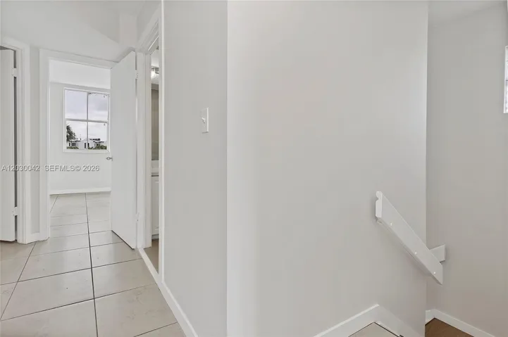 hall way to all three bedrooms