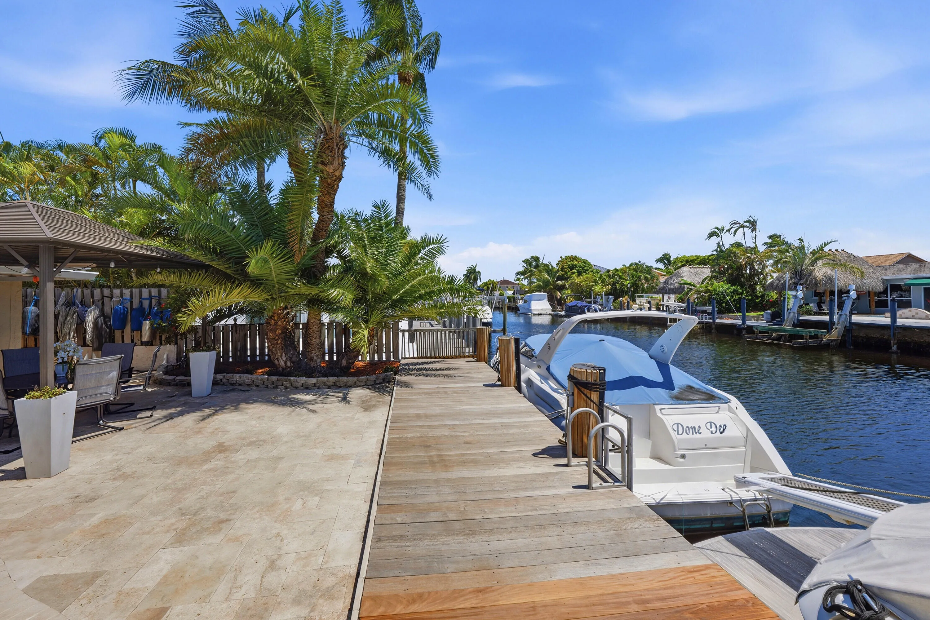 Your Ocean Access, Waterfront Lifestyle at it's Finest! 40' Dock, 70' Seawall, Freeform Pool with Rock Waterfall, Covered Patio Space for Fail Safe Outdoor Enteraining.
