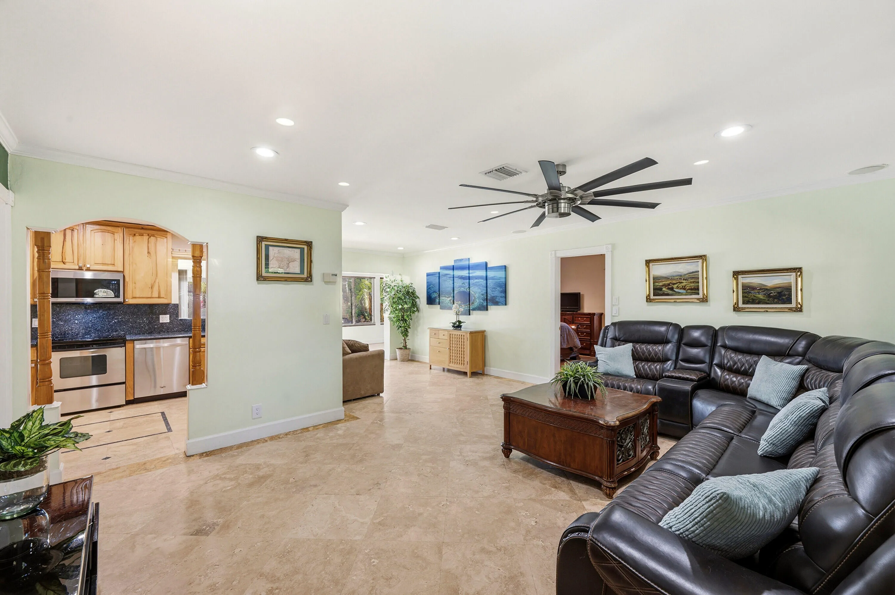Spacious & Flexible Living Room, Crown Molding, 18" Travertine Tile Floors Throughout the entire home.