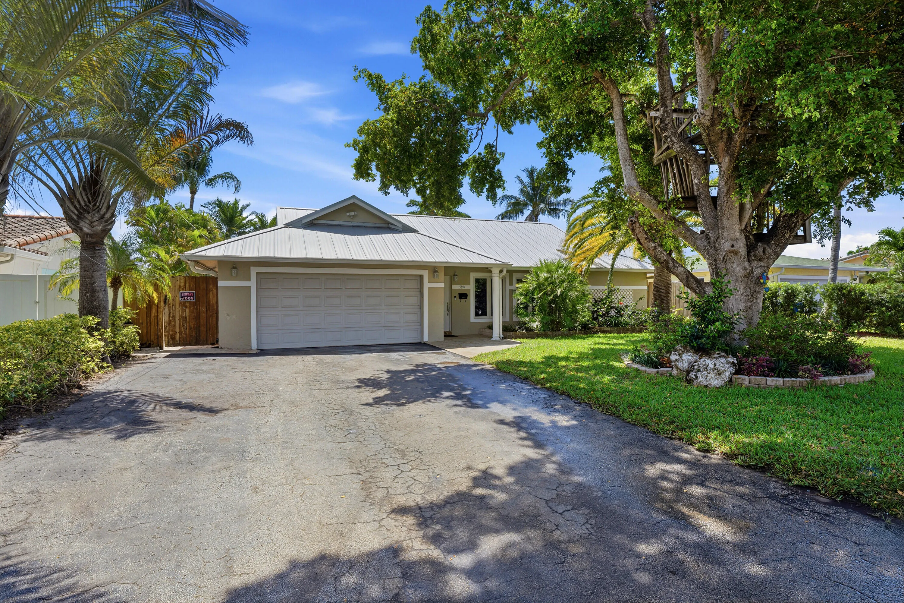 2 Car Garage, 70' Seawall 2026, 40' Dock, Travertine Pavers 2024, Freefrom Pool with Rock Waterfall, Covered Patio & More!
