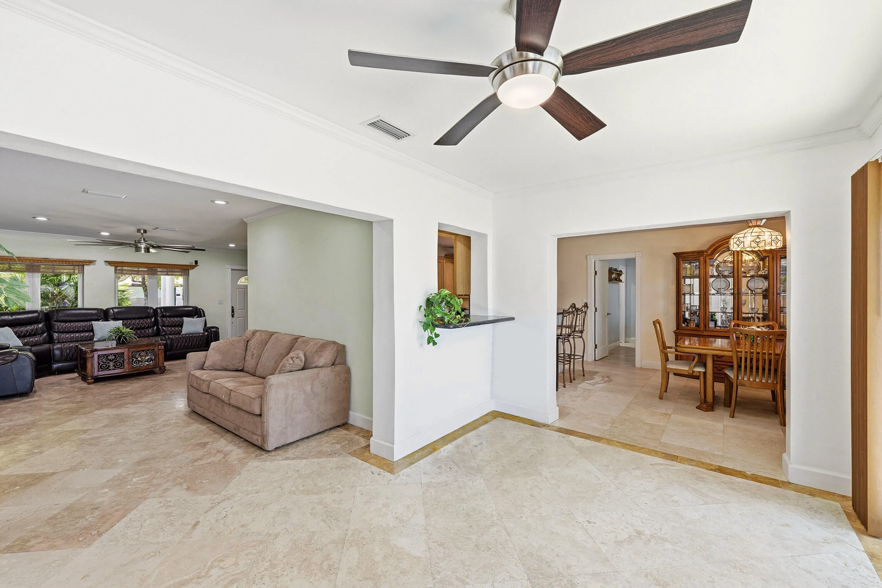 From Your Florida Room is Easy Access to the Living Room, Dining Room & The Amazing Waterfront Backyard Pool, Dock and Patio. Dining Room Chandelier doesn't convey.