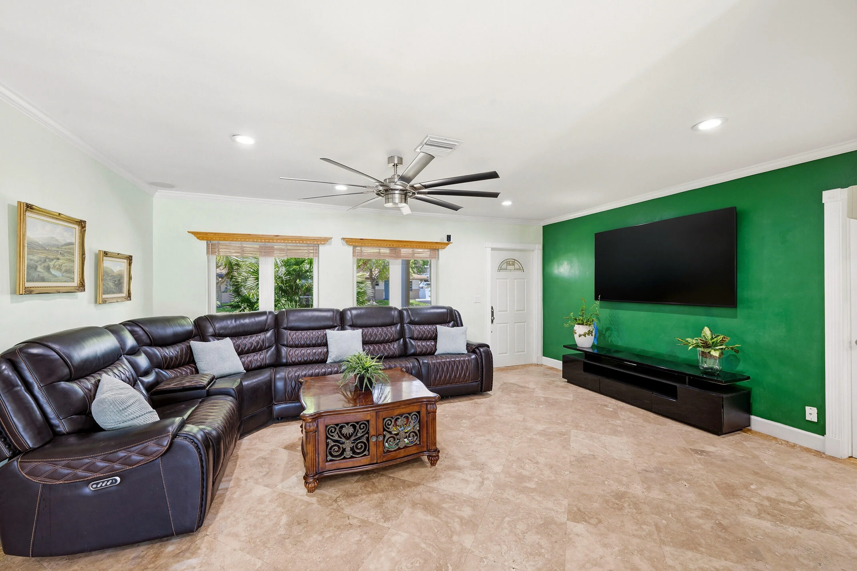 Big L-Shaped Living Room Perfect for Lounging Around or Entertaining. Room for Pool/Ping Pong Table, Foosball Table or Reading or Whatever You Can Imagine! Wall Mounted TV (Including Wall Mount) doesn't convey.