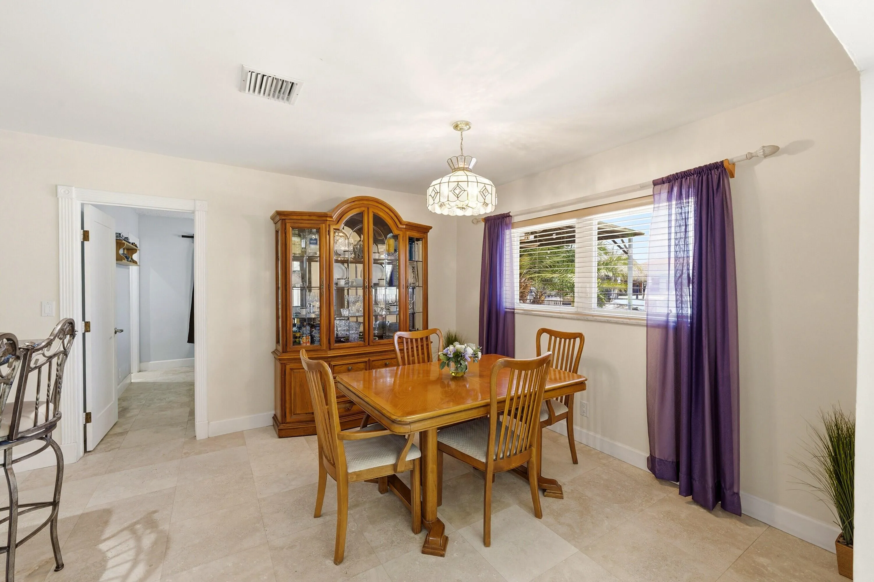Dining Room is Large Enough for Entertaining & Includes 2 Snack Bars & Pass-Thru. Guest Bedroom is next to Dining Room. Dining Room Chandelier doesn't convey.