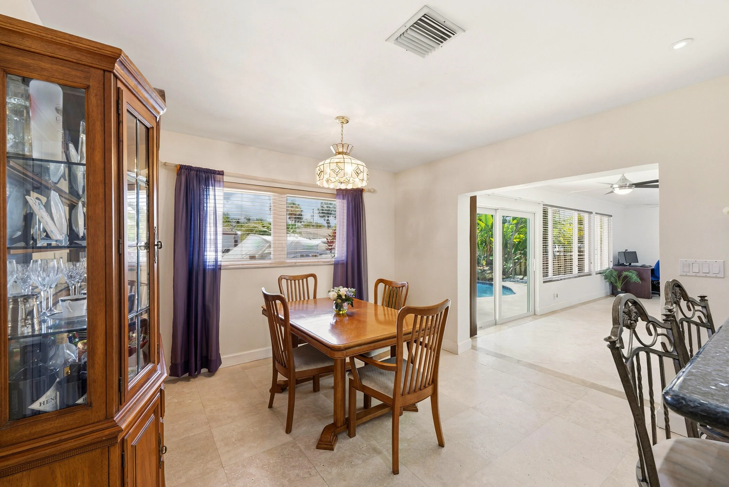 Dining Room is Conveniently situated adjacent to the Family Room and the Doors to the Fabulous Waterfront Backyard. Entertaining Made Easy! Dining Room Chandelier doesn't convey.