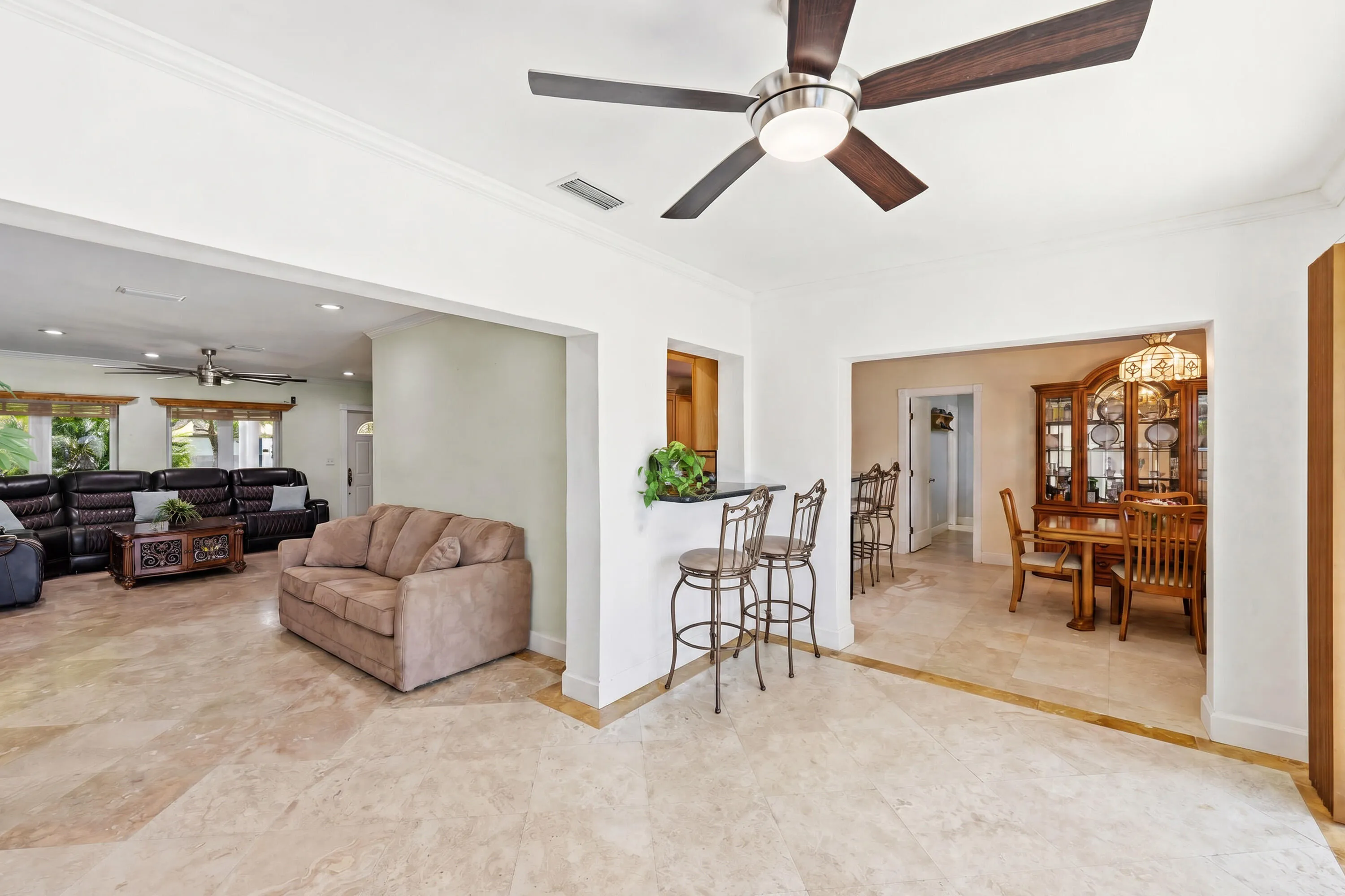 Floorplan is perfect for Entertaining Inside or Outside. You Will Love Your New Waterfront Lifestyle with Dock & Ocean Access. Dining Room Chandelier doesn't convey.