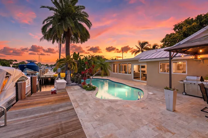 WOW! Your Ocean Access, Waterfront Lifestyle at it's Finest! 40' Dock, 70' Seawall, Freeform Pool with Rock Waterfall, Covered Patio Space for Fail Safe Outdoor Enteraining.