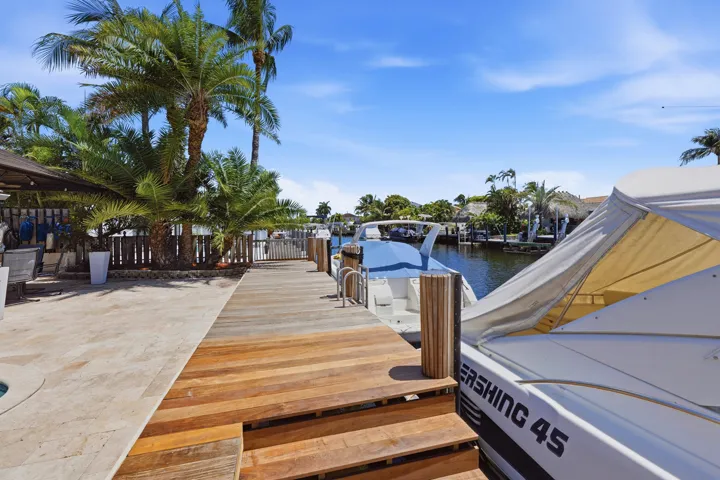 40' Dock, 70' Seawall, Freeform Pool with Rock Waterfall, Covered Patio Space for Fail Safe Outdoor Enteraining. Your Ocean Access, Waterfront Lifestyle at it's Finest!