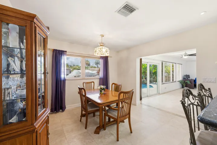 Dining Room is Conveniently situated adjacent to the Family Room and the Doors to the Fabulous Waterfront Backyard. Entertaining Made Easy! Dining Room Chandelier doesn't convey.