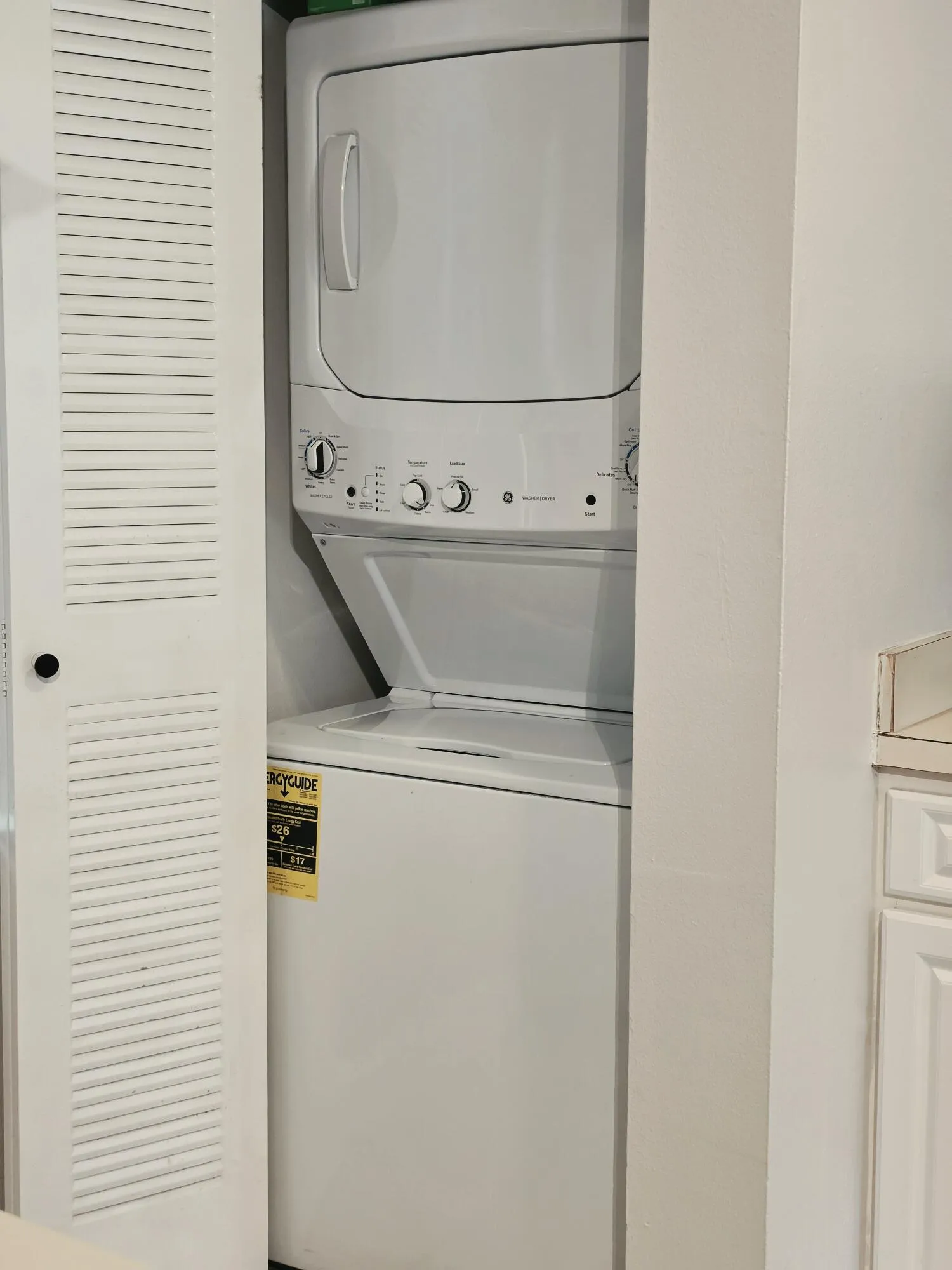 NEW LARGER MODEL STACKABLE WASHER AND DRYER IN-UNIT FOR YOUR CONVENIENCE