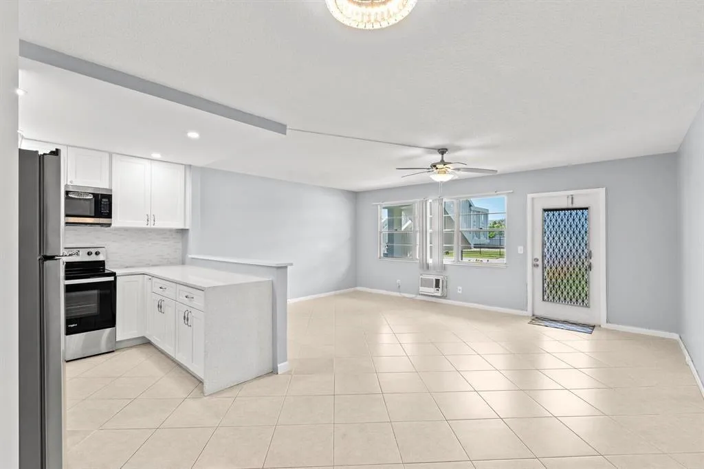 Kitchen - Living Area - Front Entrance of Condo
