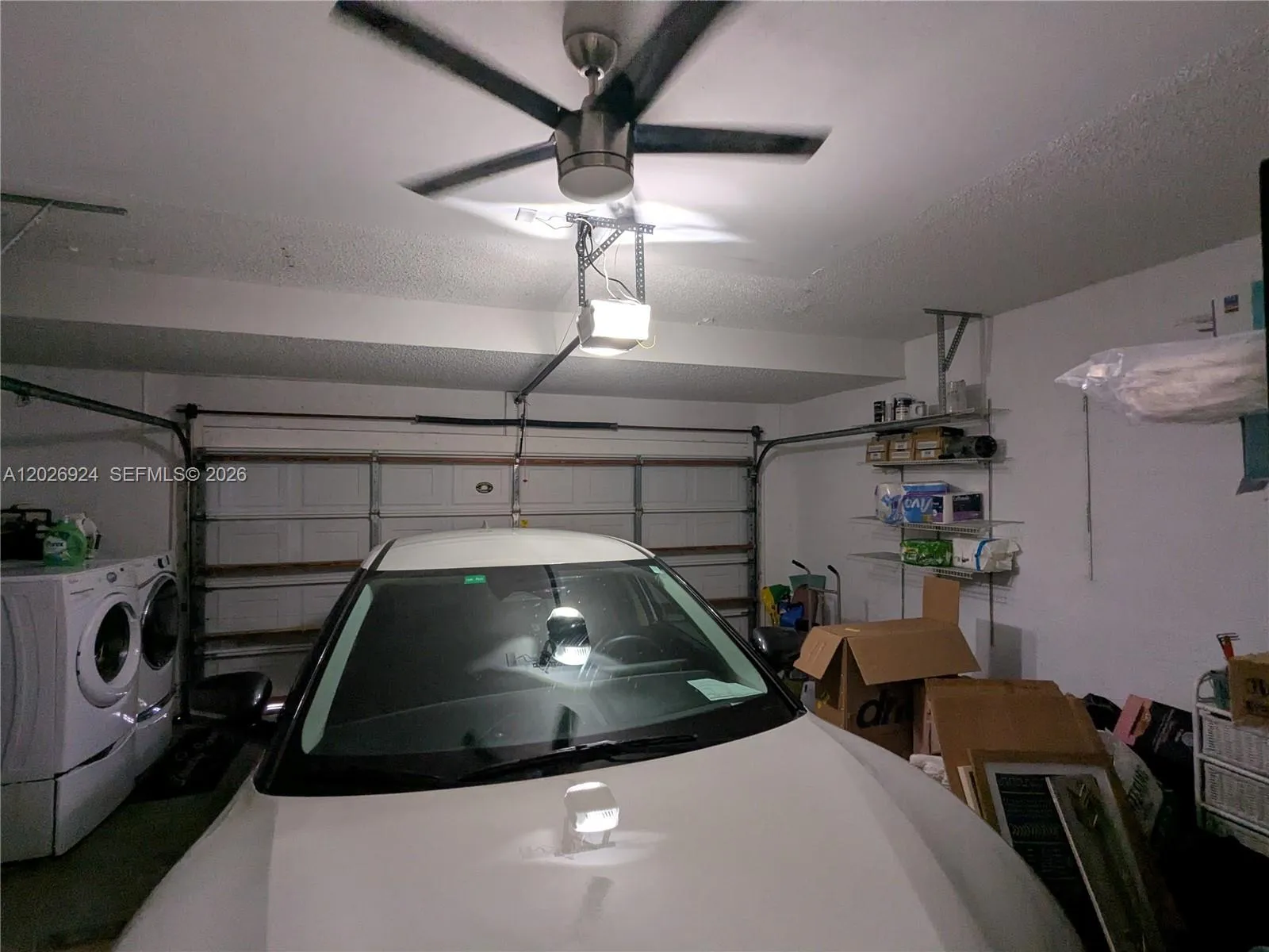 Well-maintained garage offering secure parking, additional storage options, and a dedicated laundry area for added convenience.