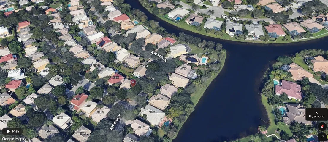 The aerial view showcases a perfectly quiet residential area, surrounded by water and lush greenery—an ideal setting that highlights the peaceful environment and natural beauty of the community