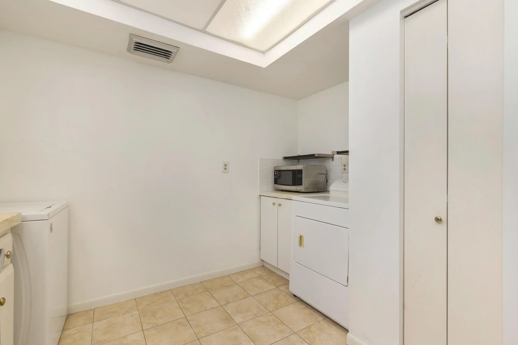 Washer/Dryer at end of large kitchen