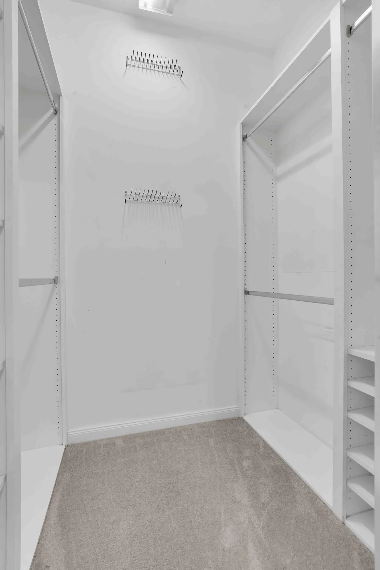 1 of 2 walk-in closets in primary bedroom